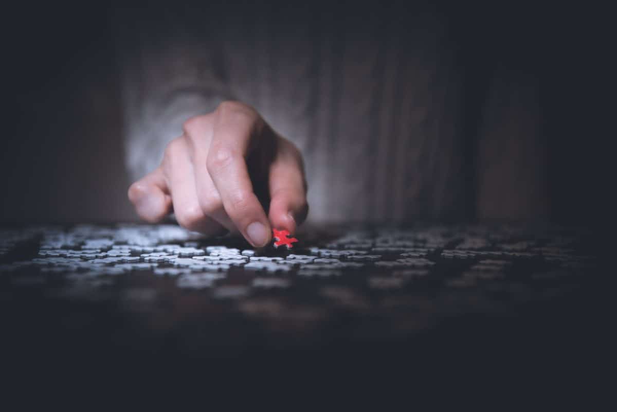 hand holding a puzzle piece to prevent mental incapacity